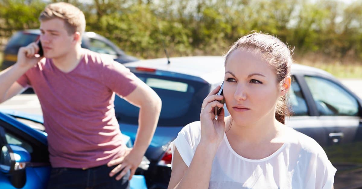 people talking on cell phones after car accident