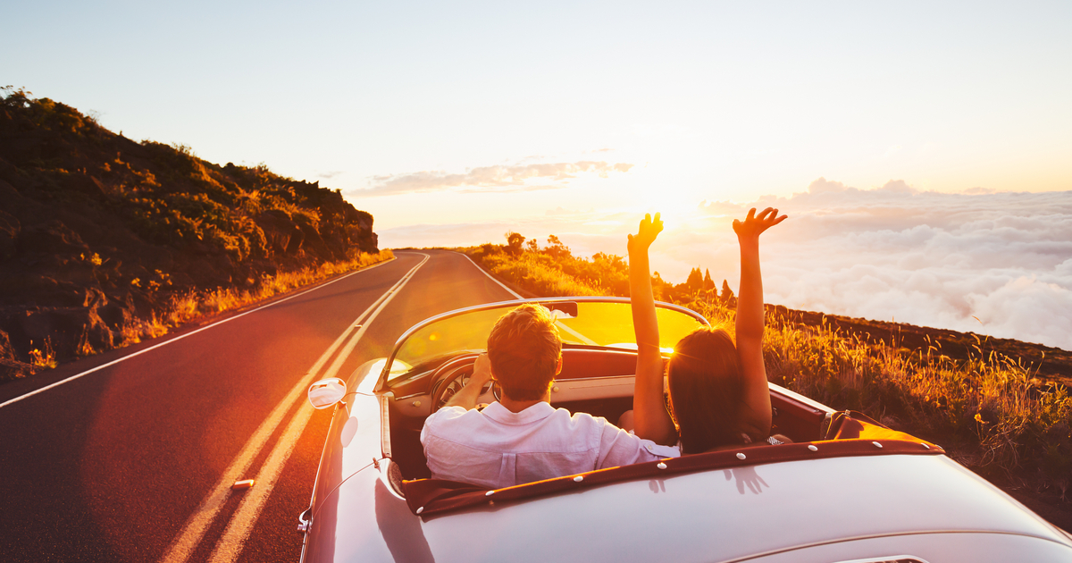 couple riding in convertible