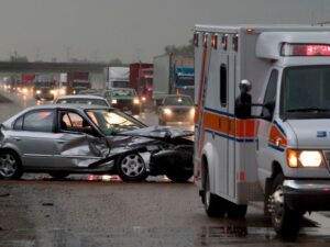 car accident scene aftermath with an ambulance